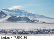 Mongolian yurts in the snowy steppe (2023 год). Редакционное фото, фотограф Саблин Станислав / Фотобанк Лори