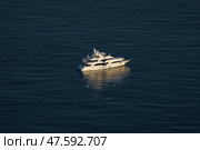 Monaco, lonely mega yacht in sea at sunset, huge motor boat, wealth life of billionaires. Стоковое фото, фотограф Vladimir Drozdin / Фотобанк Лори