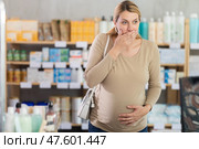 Pregnant woman vomiting in drugstore. Стоковое фото, фотограф Яков Филимонов / Фотобанк Лори