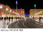 France, Nice, 12.09.2015: Place Massena at night, Avenue Jean Medecin, trams, tourists. Редакционное фото, фотограф Vladimir Drozdin / Фотобанк Лори