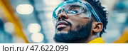 Protective Vision: Portrait of a factory worker wearing safety glasses, showcasing diligence and workplace safety. Стоковое AI-изображение, AI-художник Данила Большаков / Фотобанк Лори