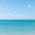Scenic vivid sea or ocean view. Group of windsurfers is surfing on the wavy sea far away at the horizon. Vacation, active lifestyle concept. Стоковое фото, фотограф Ирина Михайличенко / Фотобанк Лори