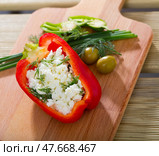 Pepper stuffed with brynza is tasty dish of Bulgarian cuisine. Стоковое фото, фотограф Яков Филимонов / Фотобанк Лори