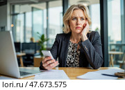 Businesswoman sitting in modern office holding phone looking worried during workday facing unexpected problem thinking about difficult decision while checking messages. Стоковое AI-изображение, AI-художник Павел Муравьев / Фотобанк Лори