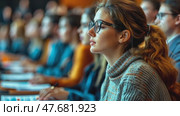 Attentive female student in glasses focuses during a lecture, taking notes in classroom setting. Стоковое AI-видео, аниматор Данила Большаков / Фотобанк Лори
