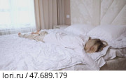 Tired young Woman lying In Bed. Portrait Of Beautiful Female Resting On Comfortable Bed In White Bedding In Light Bedroom In Morning. People Sleep. Стоковое видео, видеограф Ирина Михайличенко / Фотобанк Лори