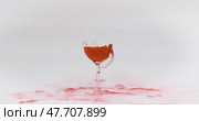 Breaking the glass of red wine in slow motion on white background. Shot on super slow motion camera 1000 fps. Стоковое видео, видеограф Андрей Армягов / Фотобанк Лори