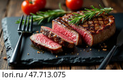Juicy mediumrare steak with rosemary on slate board. Стоковое AI-изображение, AI-художник Андрей Бакусов / Фотобанк Лори