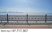 Embankment with a black fence. View of the river in motion. Стоковое видео, видеограф Mikhail Davidovich / Фотобанк Лори