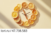 Creative wall clock design featuring dried lemon slices as decoration. Креативный дизайн настенных часов с сушеными ломтиками лимона в качестве украшения. Стоковое AI-изображение, AI-художник Katsiaryna Repich / Фотобанк Лори
