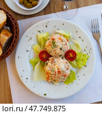 Appetizing Olivier salad with eggs, greens, vegetables, lettuce. Spanish cuisine. Стоковое фото, фотограф Яков Филимонов / Фотобанк Лори