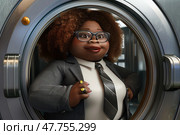 An animated character with a stylish appearance and curly hair stands confidently inside a laundromat dryer, exuding personality. Стоковое AI-изображение, AI-художник Данила Большаков / Фотобанк Лори