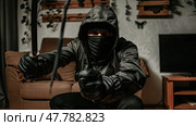 A man wearing a black mask holds a sword in a determined stance. Стоковое AI-изображение, AI-художник Данила Большаков / Фотобанк Лори