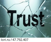 The text "Trust" on the broken glass. Стоковое AI-изображение, AI-художник Sergey Grishin / Фотобанк Лори