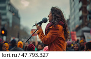 A woman confidently addresses a large crowd, speaking into a microphone with passion and conviction. Стоковое AI-изображение, AI-художник Данила Большаков / Фотобанк Лори