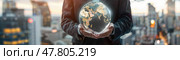 A business individual stands outdoors at twilight, cradling a radiant globe that signifies international connections and opportunities. Стоковое AI-изображение, AI-художник Данила Большаков / Фотобанк Лори