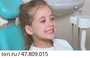 Little girl sitting in dentist chair showing her teeth to doctor. Baby teeth concept. Beautiful smiling preschool girl lost baby tooth. Dental hygiene concept. Стоковое видео, видеограф Ирина Михайличенко / Фотобанк Лори
