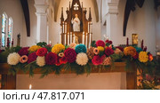 The altar is Mexican, decorated with flowers and candles for the celebration. Стоковое AI-видео, аниматор Ирина Старикова / Фотобанк Лори