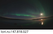 Northern Lights Time lapse 4K video, polar light or Aurora Borealis in the dark winter night sky over the arctic landscape. Стоковое видео, видеограф Николай Евсюков / Фотобанк Лори