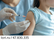 Children vaccination. Yong Asian child girl is vaccinated. Medical office blurred background. Kid giving injection shot. Syringe with Covid, coronavirus, flu vaccine. Dangerous infection disease, MPOX. Стоковое AI-изображение, AI-художник Марина Демидюк / Фотобанк Лори