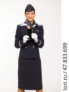 RUSSIA, MOSCOW: 21 SEPTEMBER 2019. Beautiful stewardess dressed in official blue uniform of Aeroflot Airlines. Редакционное фото, фотограф Андрей Аркуша / Фотобанк Лори