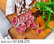 Sliced spanish sausage fuet. Стоковое фото, фотограф Яков Филимонов / Фотобанк Лори
