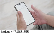 Man using ChatGPT in the mobile phone. This app is a chatbot based on Artificial Intelligence developed by OpenAI. Dubai, UAE: 07.05.2025. High quality. Стоковое видео, видеограф Feruza Tashmetova / Фотобанк Лори