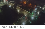 Movement of cars through an adjustable intersection with traffic light. Top view, timelapse. Traffic on city highway at night. Kostroma, Russia, April 17, 2025. Редакционное видео, видеограф Ирина / Фотобанк Лори