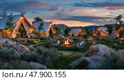 A collection of tents arranged on a vibrant green field, creating a temporary living space. The scene showcases the contrast between the man-made structures and the natural surroundings. Стоковое AI-изображение, AI-художник Данила Большаков / Фотобанк Лори
