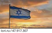 Israel flag waving in the wind against an orange dramatic sunset sky. Стоковое AI-видео, аниматор Михаил Строгалев / Фотобанк Лори