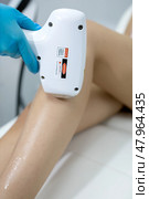 Hair removal procedure. Cropped shot of young fit woman client receiving laser hair removal procedure on body in beauty clinic. Women beauty and cosmetology concept. Стоковое фото, фотограф Роготнева Виктория / Фотобанк Лори