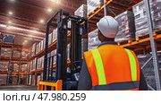 A worker operating an autonomous Robotic transportation or automated guided vehicle systems in warehouse storage. Стоковое AI-видео, аниматор Михаил Строгалев / Фотобанк Лори