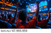 Enthusiastic supporters cheer passionately as their team scores, surrounded by a vibrant atmosphere and illuminated screens displaying the game. Стоковое AI-изображение, AI-художник Данила Большаков / Фотобанк Лори