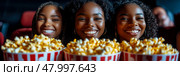 Three friends are sharing popcorn while enjoying a movie at a cinema, beaming with joy in a warm and inviting atmosphere. Стоковое AI-изображение, AI-художник Данила Большаков / Фотобанк Лори