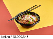 Birria ramen, consomme soup with beef and noodle. Mix of Mexican and Asian cuisine. Стоковое фото, фотограф Ирина Буракова / Фотобанк Лори