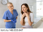 Sick female patient having aches and visiting doctor. Стоковое фото, фотограф Яков Филимонов / Фотобанк Лори
