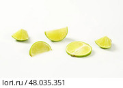 Fresh lime fruit cut into pieces. Стоковое фото, фотограф Alena Dvorakova / PantherMedia / Фотобанк Лори