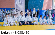 Moscow, Russia, April 24, 2025: Children practice martial arts with a coach in the gym, sambo, judo, aikido. Редакционное фото, фотограф Igor Skripachev / Фотобанк Лори