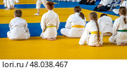 Moscow, Russia, April 24, 2025: Children practice martial arts with a coach in the gym, sambo, judo, aikido. Редакционное фото, фотограф Igor Skripachev / Фотобанк Лори