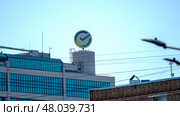 Moscow, Russia, 04 April 2025: Sberbank's logo on a building in Moscow. Редакционное фото, фотограф Igor Skripachev / Фотобанк Лори