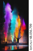 Singer performing on stage with colorful smoke effects. Стоковое AI-видео, аниматор Юрий Поздников / Фотобанк Лори