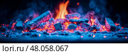 Glowing Embers: A Close-Up of Burning Charcoal with Blue and Red Hues. Стоковое AI-изображение, AI-художник Данила Большаков / Фотобанк Лори