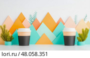 Stylish Coffee Cups with Pastel Mountain Background. Стоковое AI-изображение, AI-художник Данила Большаков / Фотобанк Лори