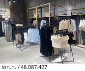 Contemporary retail store interior displaying casual women's summer wear. Стоковое фото, фотограф Виктория Тельминова / Фотобанк Лори