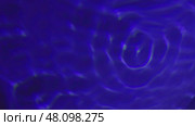Swirling blue liquid creating concentric circles. Стоковая иллюстрация, иллюстратор David Kashakhi / Фотобанк Лори