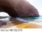 Natural red arch on atlantic ocean coast, Legzira beach. Red archs on atlantic ocean coast. Sidi Ifni, Morocco, Africa (2024 год). Стоковое фото, фотограф Евгений Ткачёв / Фотобанк Лори