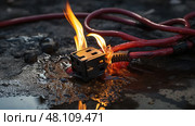 damaged extension cord fire ai generated. Стоковое AI-изображение, AI-художник Vectorwin / Фотобанк Лори