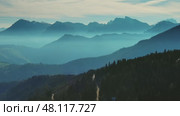 Aerial view of mountains under mist morning. Стоковое видео, видеограф Михаил Коханчиков / Фотобанк Лори