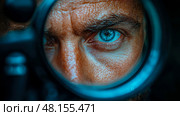 A man's blue eye is sharply focused through the lens of a rifle scope, revealing emotion and tension in a dark setting. Стоковое AI-изображение, AI-художник Данила Большаков / Фотобанк Лори