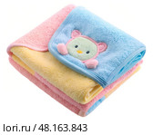 A cozy arrangement of a soft baby blanket featuring pastel colors and a charming bear design. Perfect for nurseries, cuddling, or adding warmth to any child\'s room. Стоковое AI-изображение, AI-художник Ольга Игнашина / Фотобанк Лори